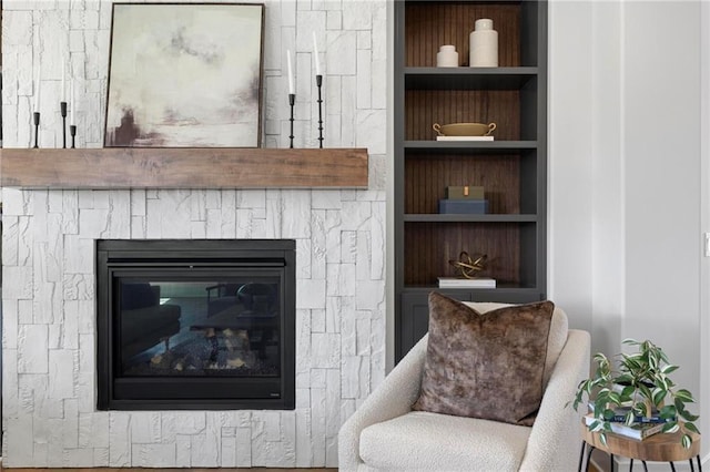 18452 Windsor St, Overland Park, KS 66085 - living area with built in features and a stone fireplace