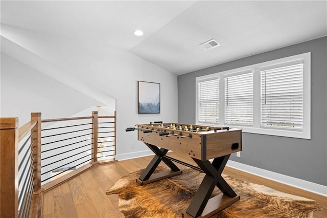18452 Windsor St, Overland Park, KS 66085 - game room featuring recessed lighting, lofted ceiling, wood finished floors, visible vents, and baseboards