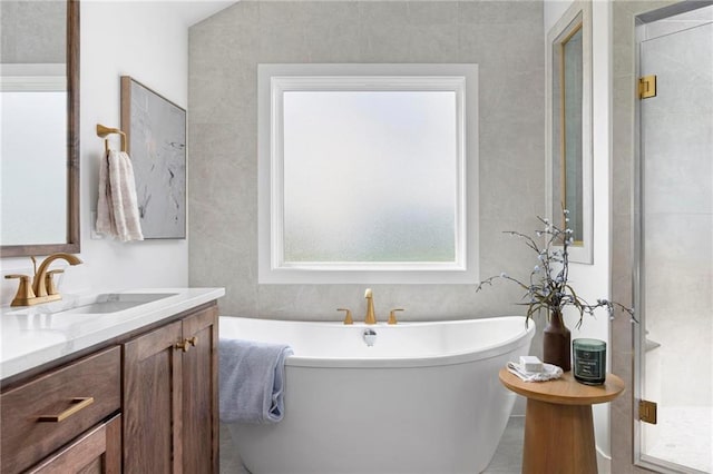 18452 Windsor St, Overland Park, KS 66085 - full bath featuring vanity, a soaking tub, and a stall shower