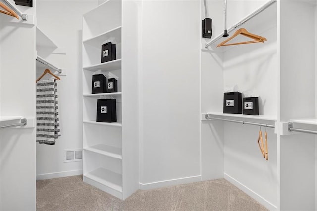 18452 Windsor St, Overland Park, KS 66085 - walk in closet featuring carpet floors and visible vents