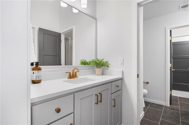 18452 Windsor St, Overland Park, KS 66085 - full bathroom with baseboards, visible vents, toilet, and vanity