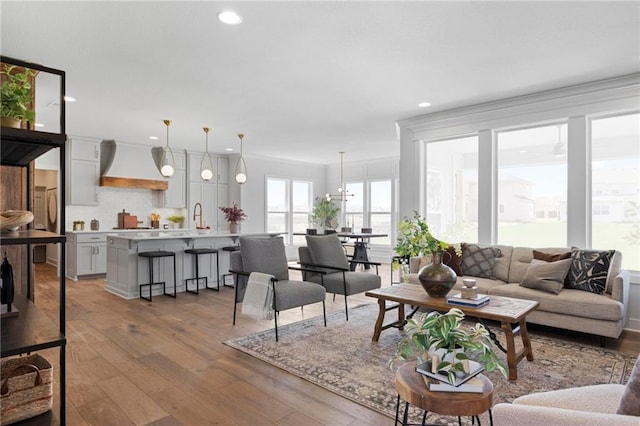 18452 Windsor St, Overland Park, KS 66085 - living area with wood-type flooring, ornamental molding, and recessed lighting