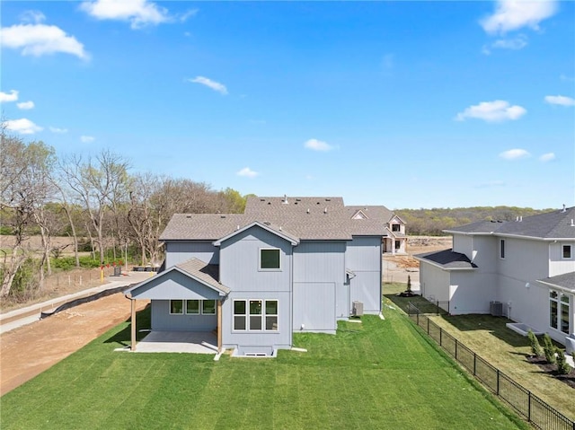 18452 Windsor St, Overland Park, KS 66085 - rear view of house featuring a yard, central AC unit, a patio, and fence