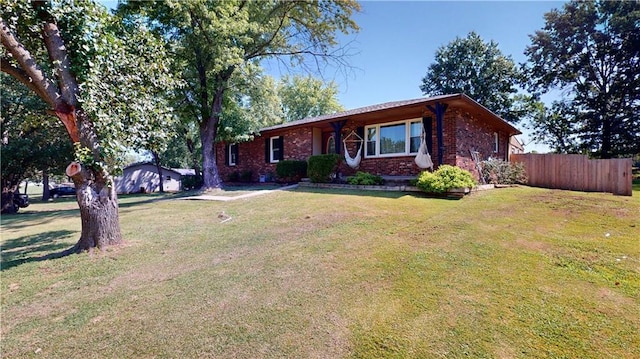 ranch-style home with a front lawn