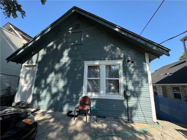 view of home's exterior with fence