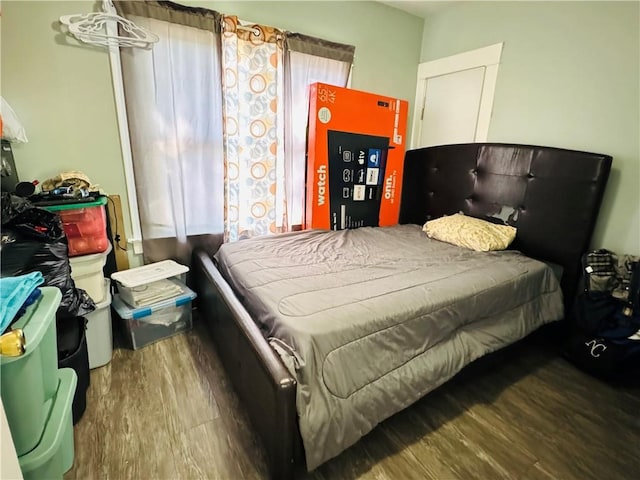 bedroom with wood finished floors