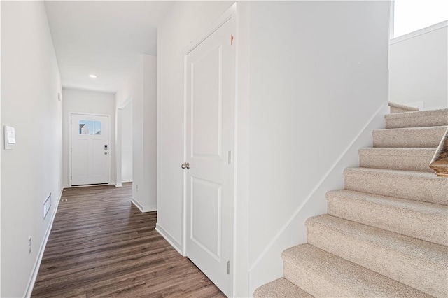 staircase featuring hardwood / wood-style flooring