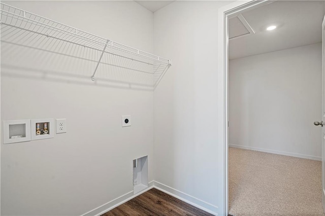 clothes washing area with hookup for an electric dryer, hookup for a washing machine, and dark hardwood / wood-style floors