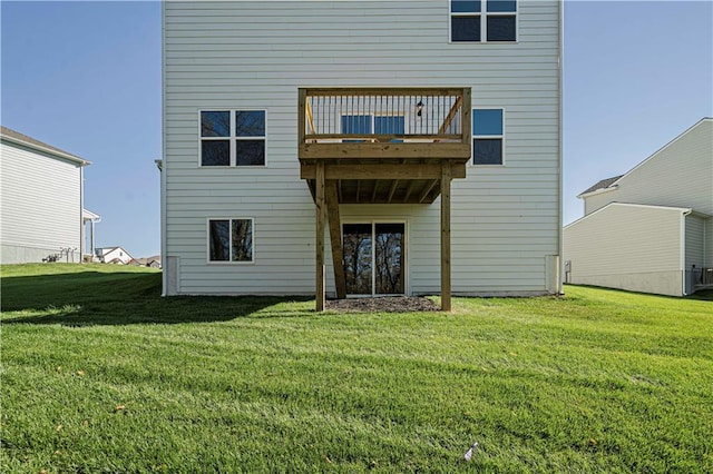 rear view of house with a yard