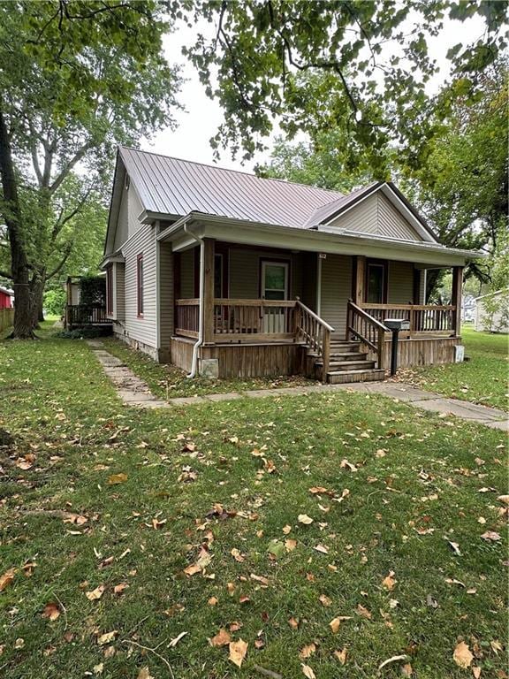 view of front of property with a front lawn and a porch