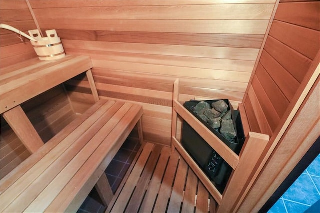 view of sauna / steam room featuring wood walls