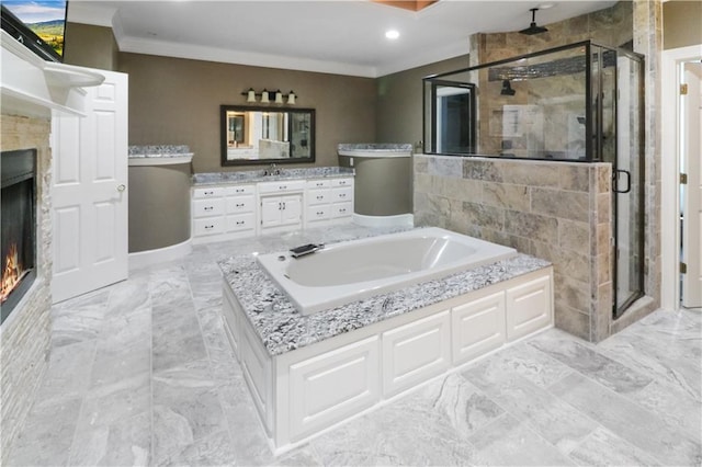 full bath with marble finish floor, ornamental molding, a shower stall, a warm lit fireplace, and a bath