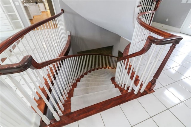 stairs featuring tile patterned floors