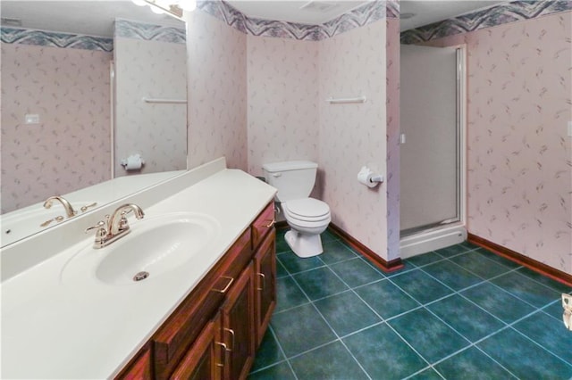 bathroom featuring a stall shower, vanity, baseboards, and wallpapered walls