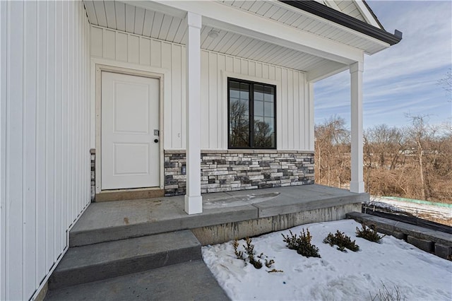 view of snow covered property entrance