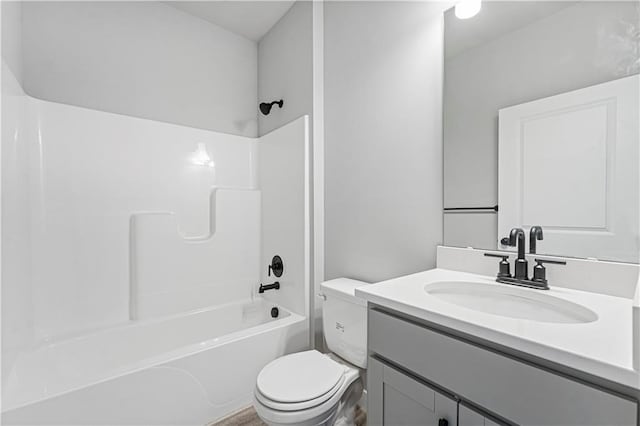 full bath featuring shower / bath combination, vanity, and toilet