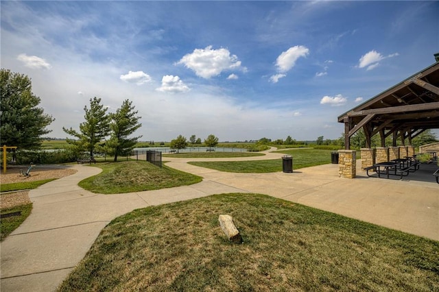 view of property's community with a yard and a gazebo