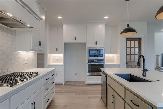 kitchen featuring white cabinetry, appliances with stainless steel finishes, and sink