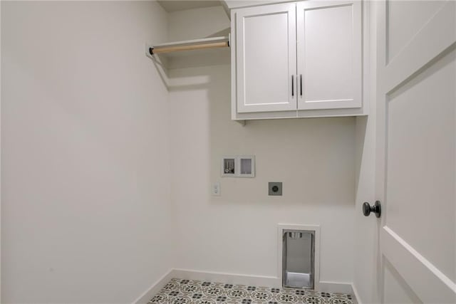 laundry area with hookup for a washing machine, electric dryer hookup, and cabinets