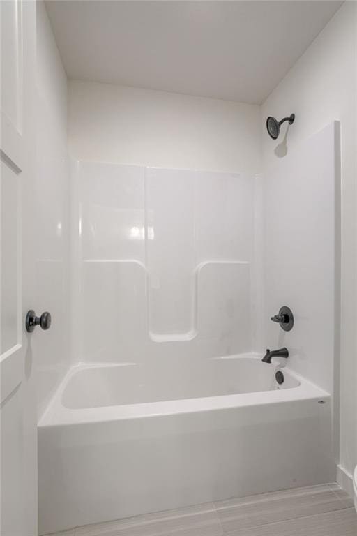 bathroom featuring washtub / shower combination