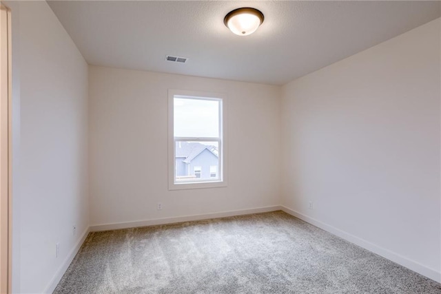 empty room with carpet flooring