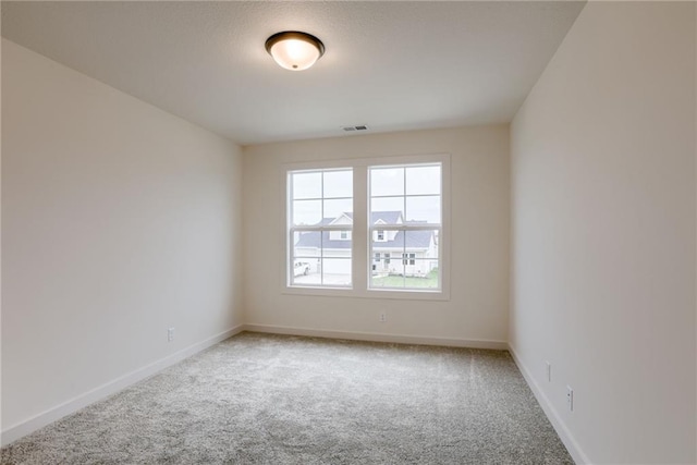 spare room featuring carpet flooring