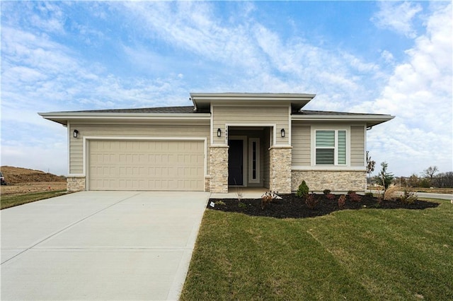 1602 NW 104th Ter, Kansas City, MO 64155 - prairie-style house featuring a front lawn, stone siding, a garage, and driveway