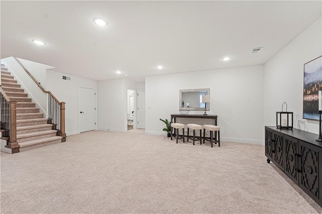 1602 NW 104th Ter, Kansas City, MO 64155 - sitting room featuring carpet flooring, stairway, baseboards, visible vents, and recessed lighting