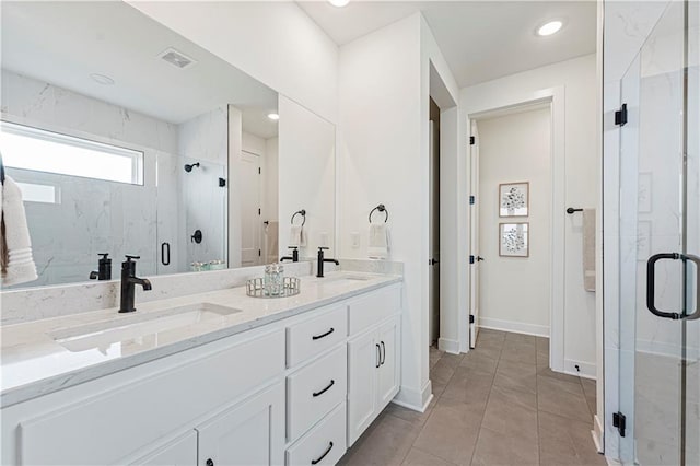 1602 NW 104th Ter, Kansas City, MO 64155 - full bathroom featuring a marble finish shower, visible vents, a sink, and double vanity