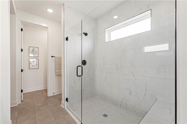 bathroom featuring walk in shower and tile patterned flooring