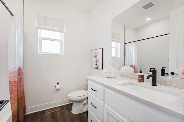 1602 NW 104th Ter, Kansas City, MO 64155 - bathroom with toilet, visible vents, and a healthy amount of sunlight