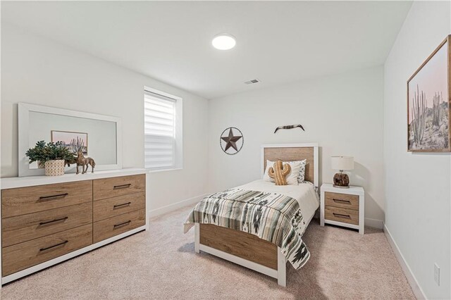 1602 NW 104th Ter, Kansas City, MO 64155 - bedroom featuring baseboards, visible vents, and light colored carpet