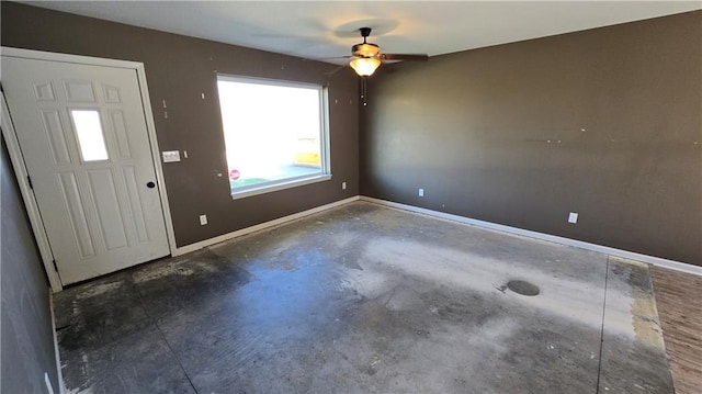 entrance foyer with ceiling fan