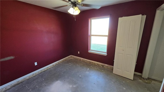 unfurnished room with concrete flooring and ceiling fan