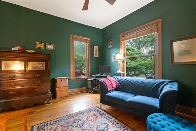 interior space featuring a wealth of natural light, ceiling fan, and light wood-type flooring