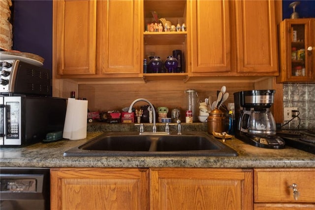 kitchen with decorative backsplash and sink