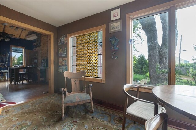 sitting room featuring dark hardwood / wood-style floors and ceiling fan