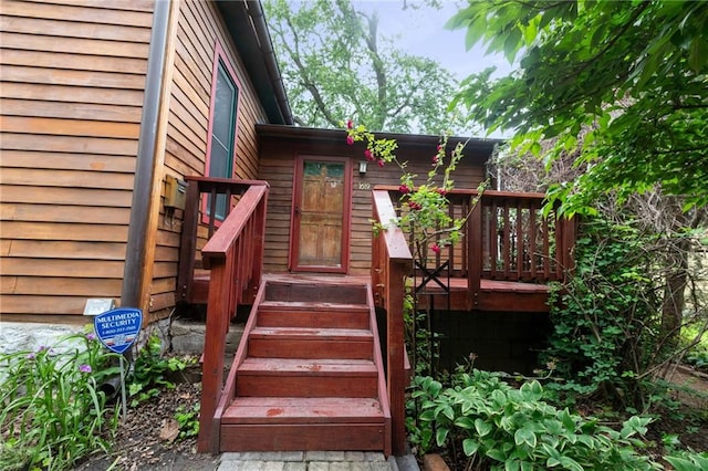 doorway to property featuring a wooden deck