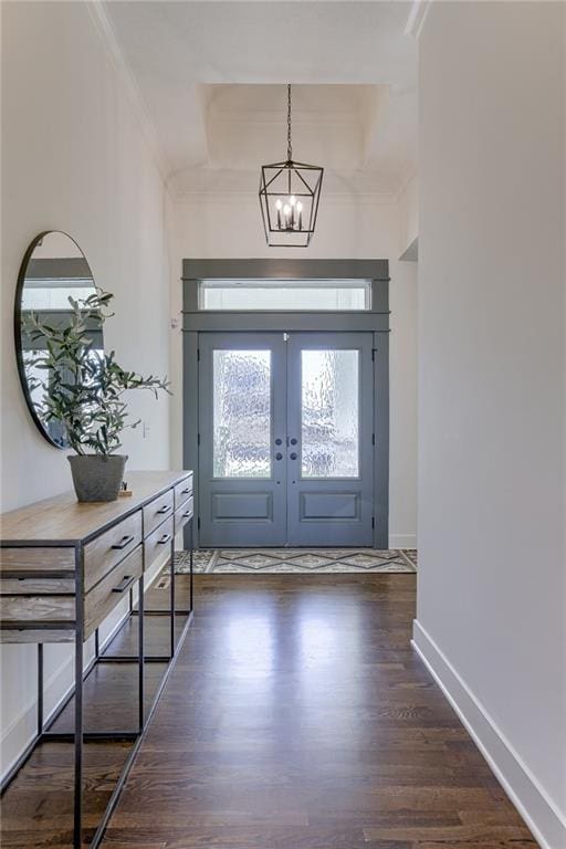 12300 S Hastings St, Olathe, KS 66061 - foyer with dark wood-style flooring, a chandelier, ornamental molding, and french doors
