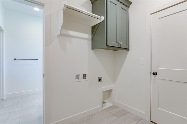 12300 S Hastings St, Olathe, KS 66061 - laundry room featuring hookup for an electric dryer, hookup for a washing machine, and cabinet space