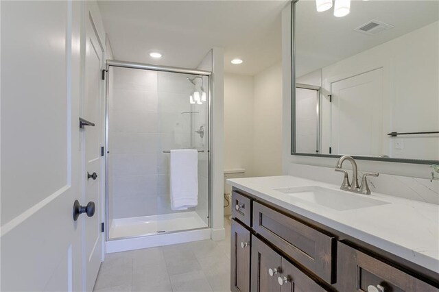 12300 S Hastings St, Olathe, KS 66061 - bathroom with tile patterned flooring, vanity, a shower stall, and recessed lighting