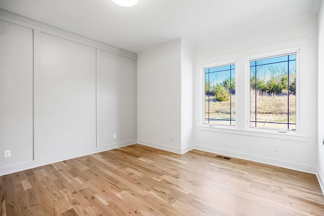 12484 S Barth Rd, Olathe, KS 66061 - spare room featuring light wood-type flooring and baseboards