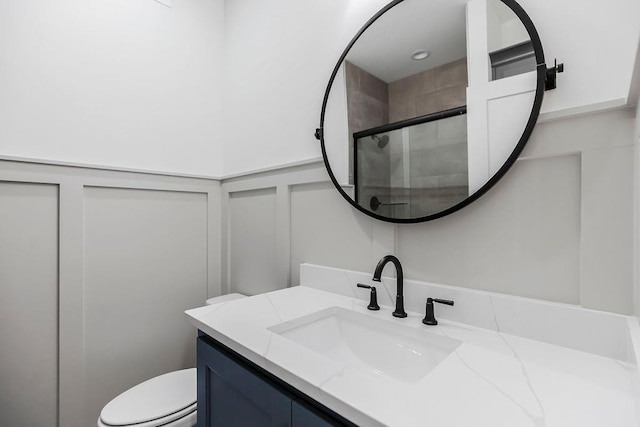 12484 S Barth Rd, Olathe, KS 66061 - bathroom with a decorative wall, vanity, a shower stall, and a wainscoted wall