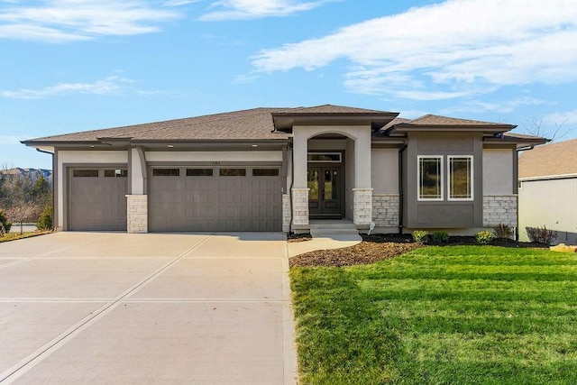 12484 S Barth Rd, Olathe, KS 66061 - prairie-style house with stone siding, an attached garage, concrete driveway, stucco siding, and a front lawn