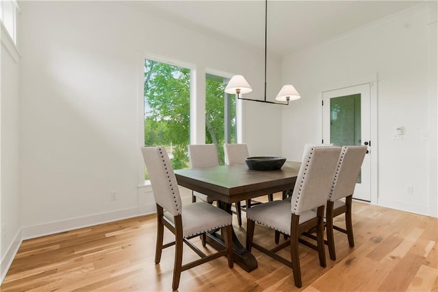 12484 S Barth Rd, Olathe, KS 66061 - dining area featuring light wood-style flooring and baseboards