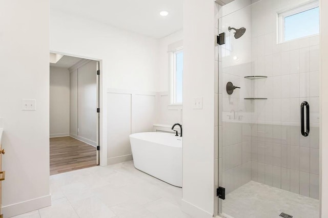 12484 S Barth Rd, Olathe, KS 66061 - full bath with a shower stall, a soaking tub, wainscoting, tile patterned flooring, and recessed lighting