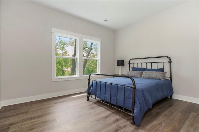 12484 S Barth Rd, Olathe, KS 66061 - bedroom with baseboards and wood finished floors