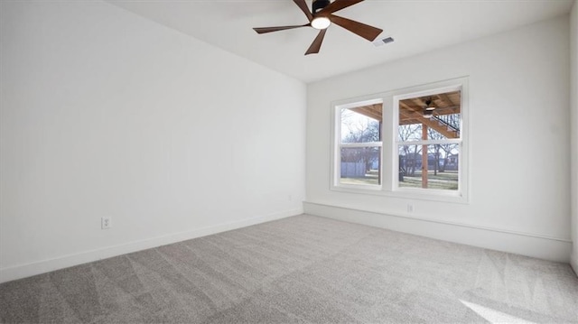 spare room with carpet floors and ceiling fan