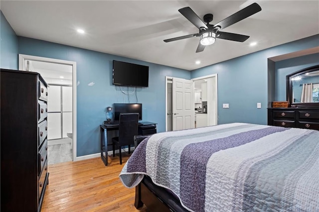 bedroom featuring light wood-type flooring, ensuite bath, and ceiling fan