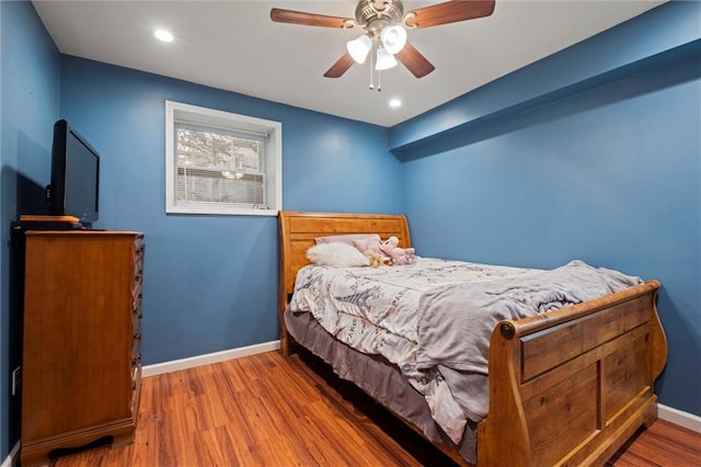 bedroom featuring hardwood / wood-style flooring and ceiling fan